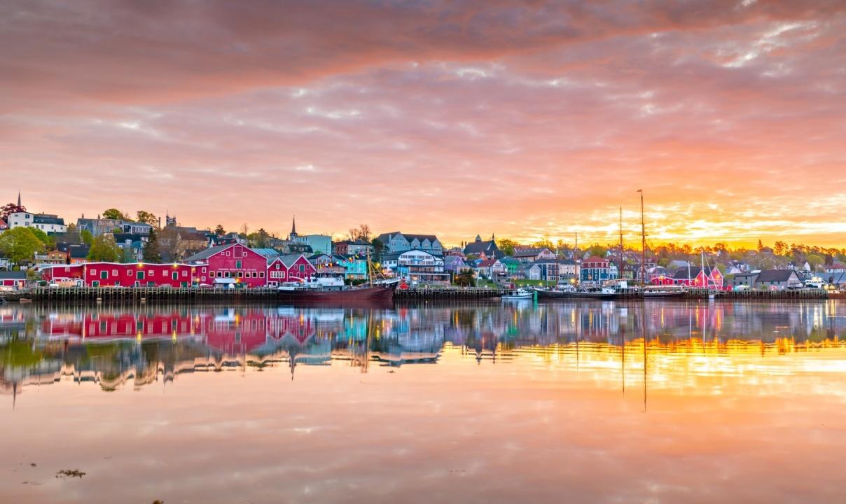 A colourful waterfront town at sunset