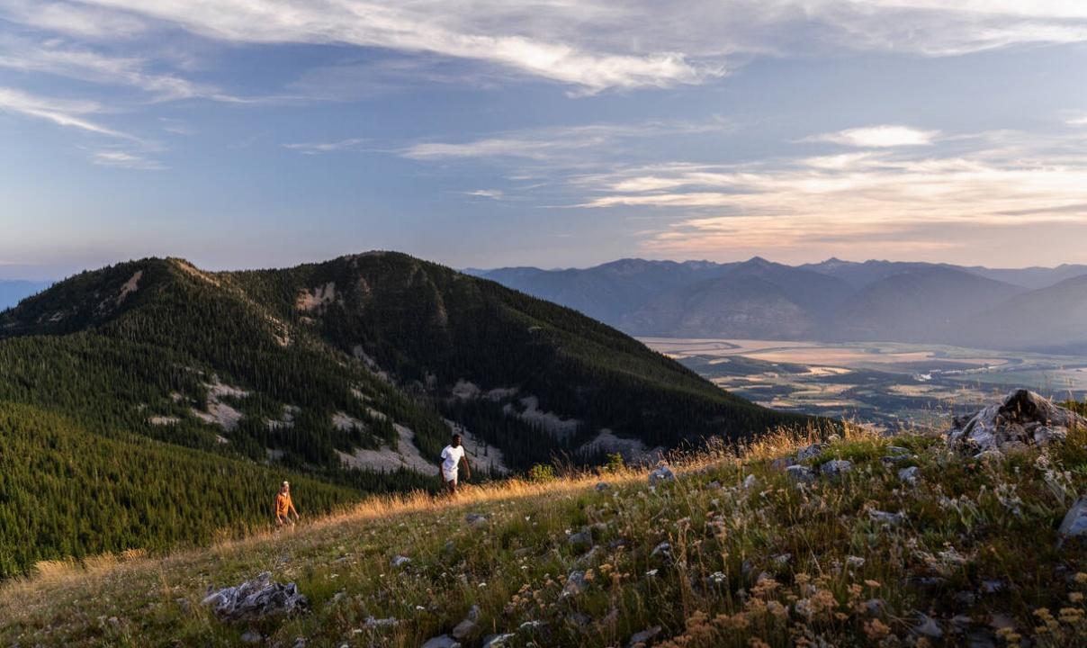 Two people hiking the Mt. Thompson Rim Trail.