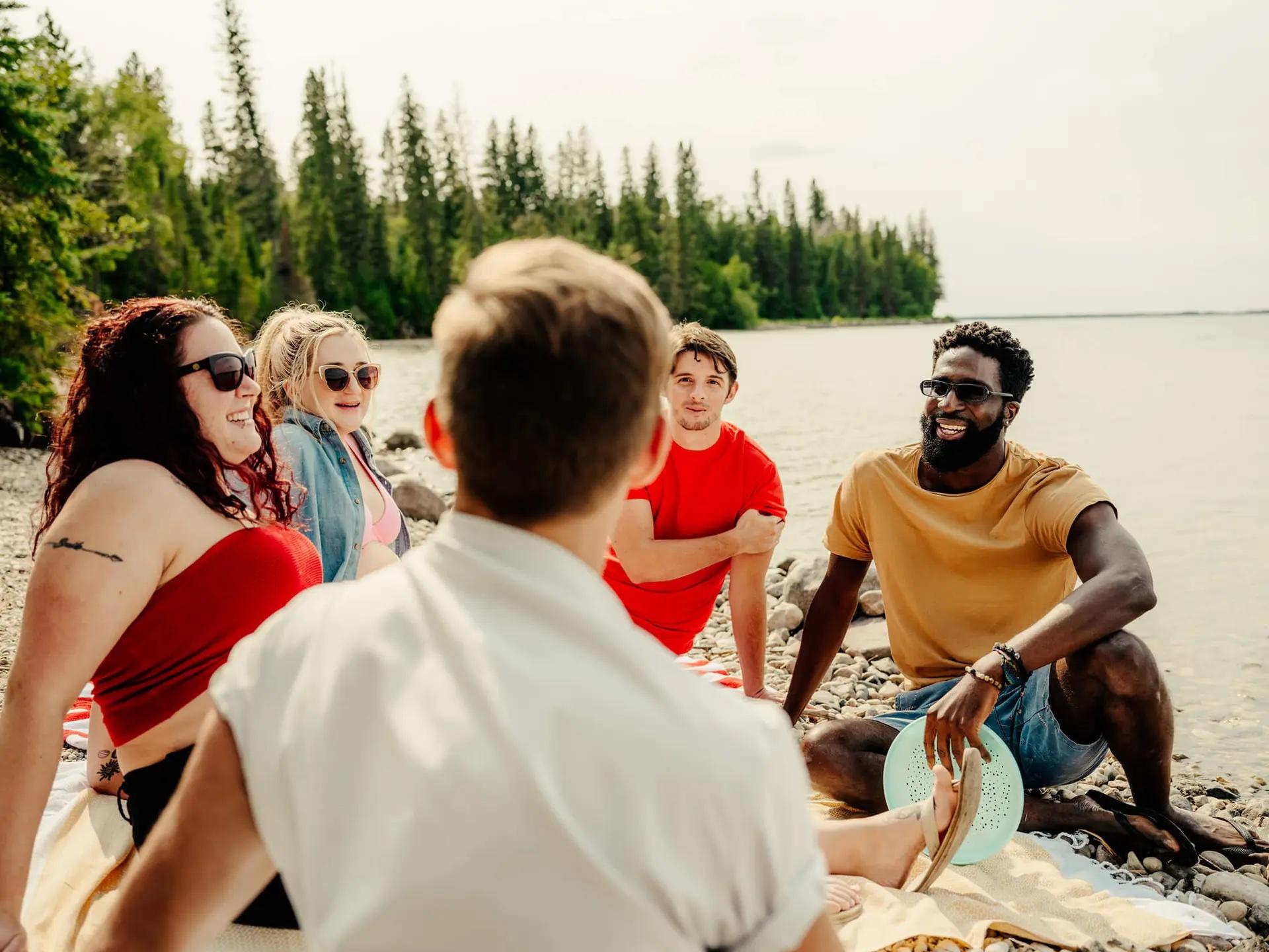 A group of friends hanging out on the beach