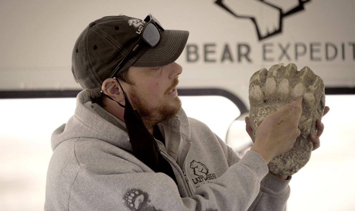 Person holding a bear paw mold