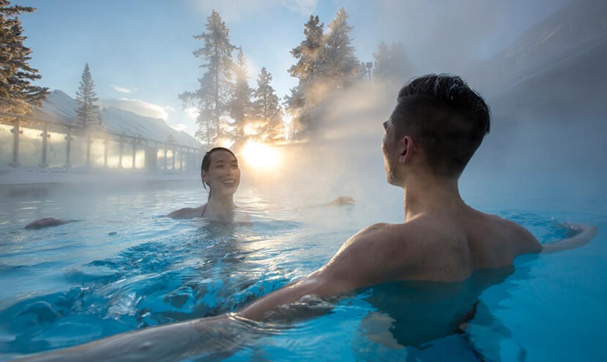 Two people enjoying a soak at the Banff Hot Springs.