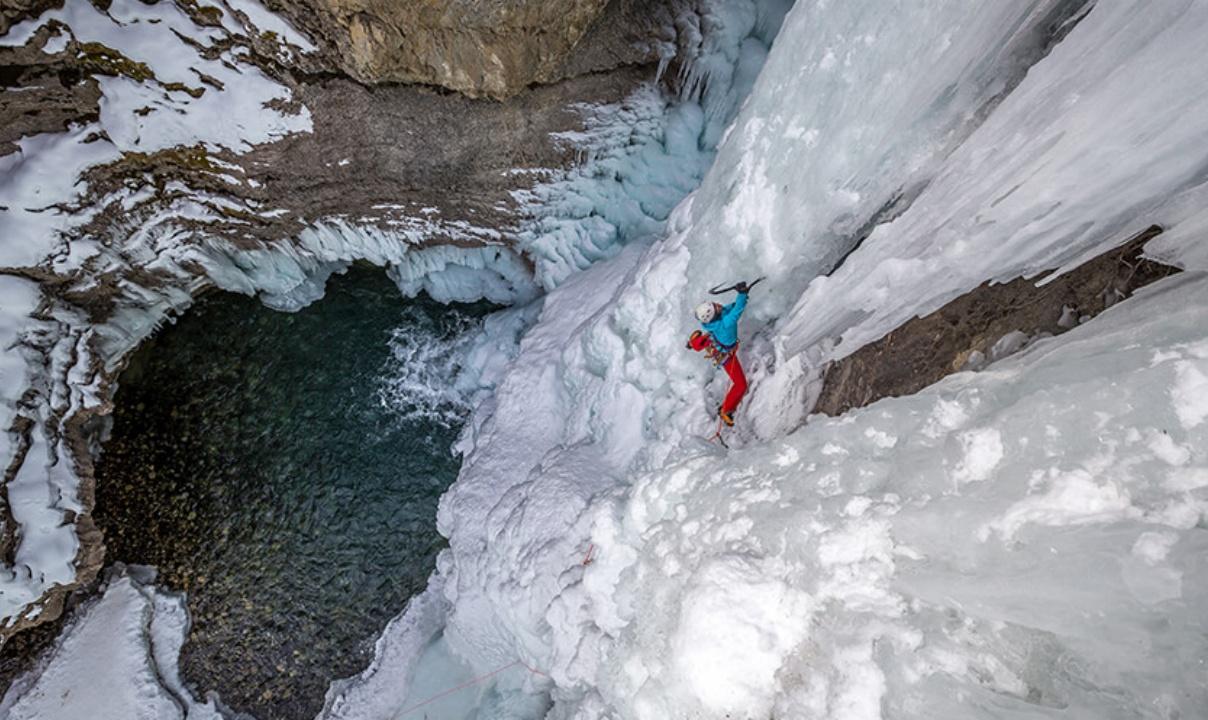 An ice climber climbing in Johnston Canyon.